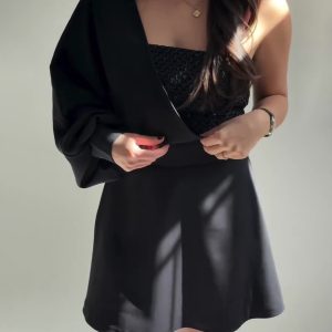 Black Two-Piece Set With Textured Strapless Top And Flared Mini Skirt