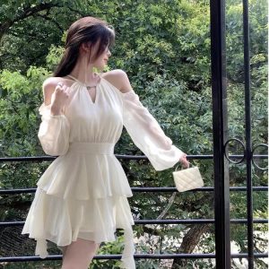 Apricotcolored Longsleeved Dress With A Cinched Waist Slimming Effect And Ethereal Ruffled Hem